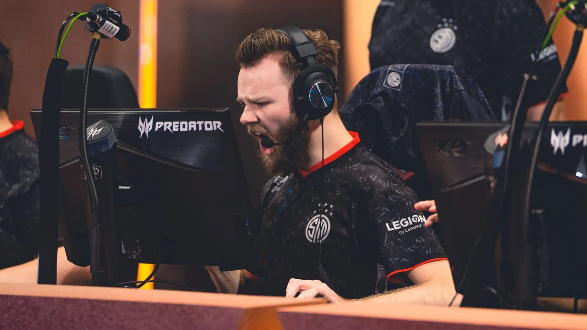 Photo of a TSM player looking at their monitor