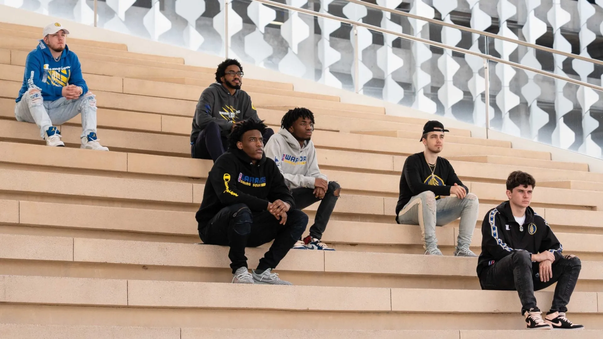 Warriors gaming squad sitting on stairs