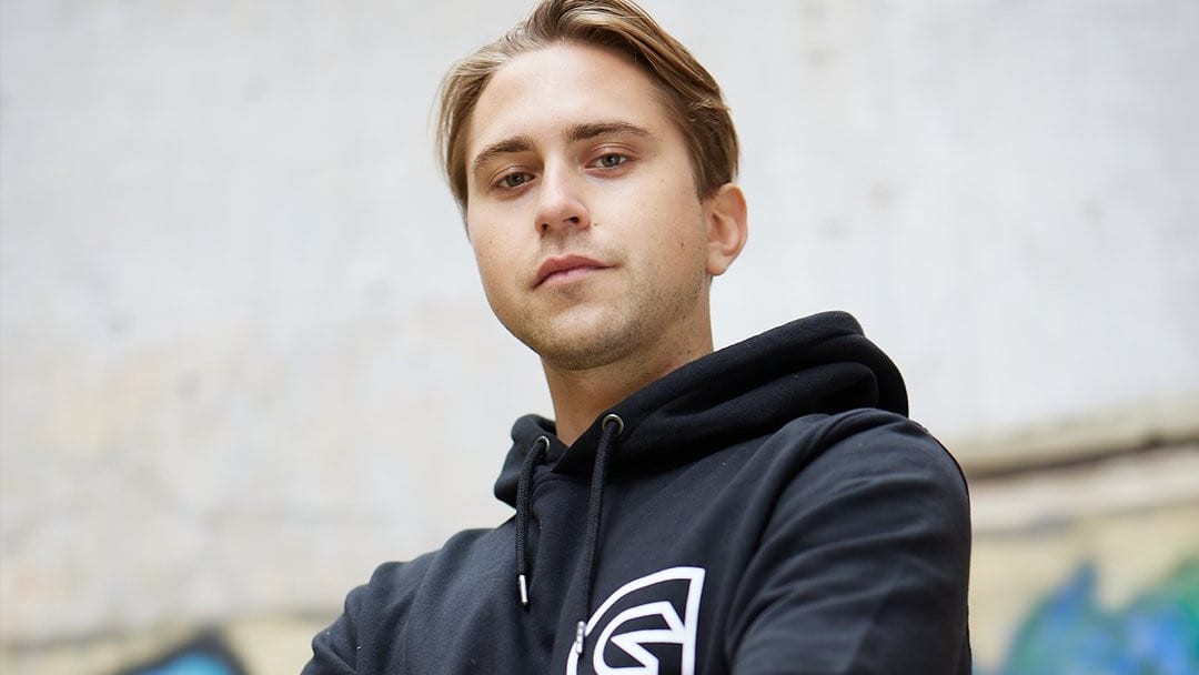 Guild Esports' draken poses in a Guild hoodie