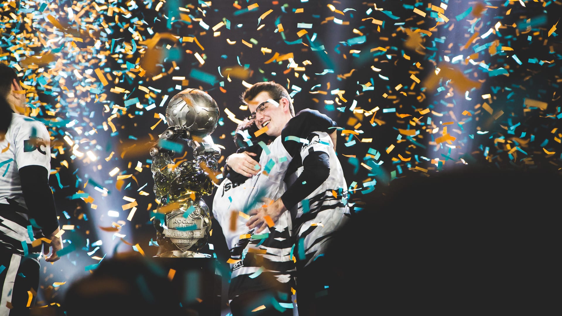 NRG players GarrettG and Justin hug after winning RLCS8