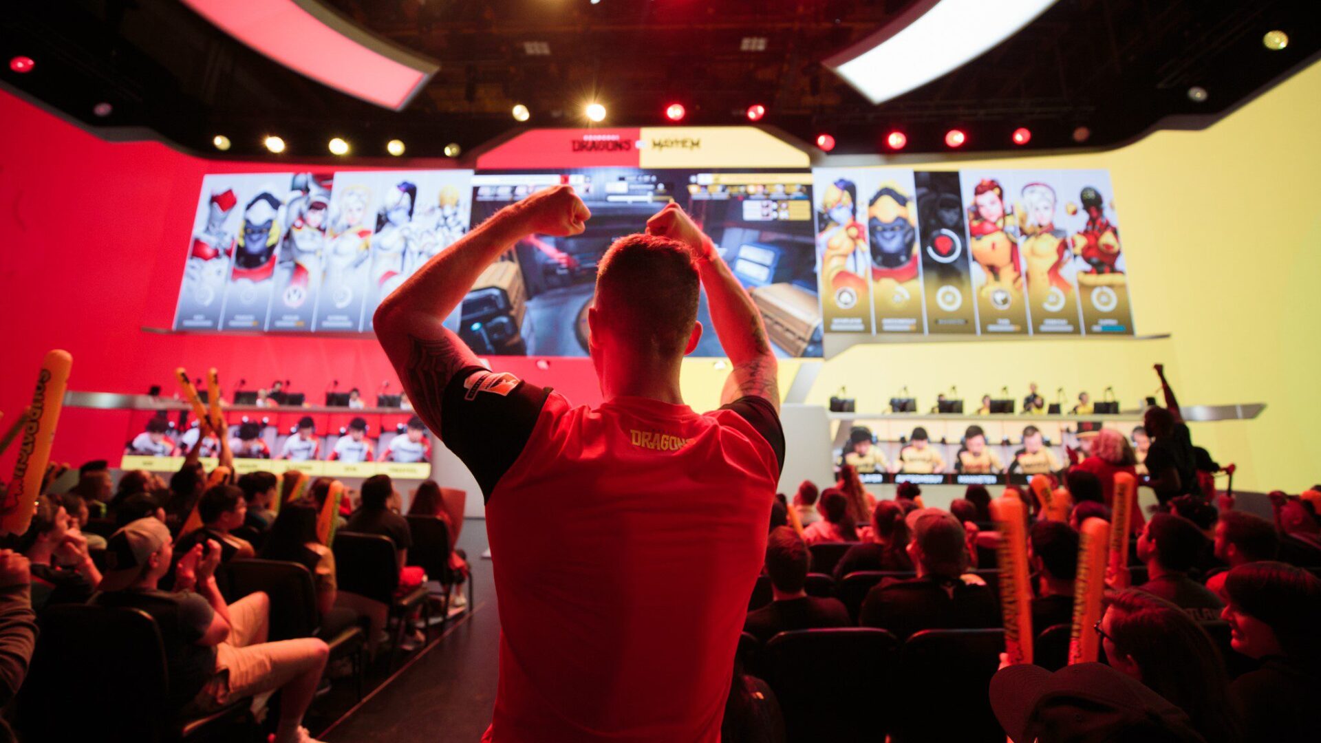 A Shanghai Dragons fan cheers his team on Five W's