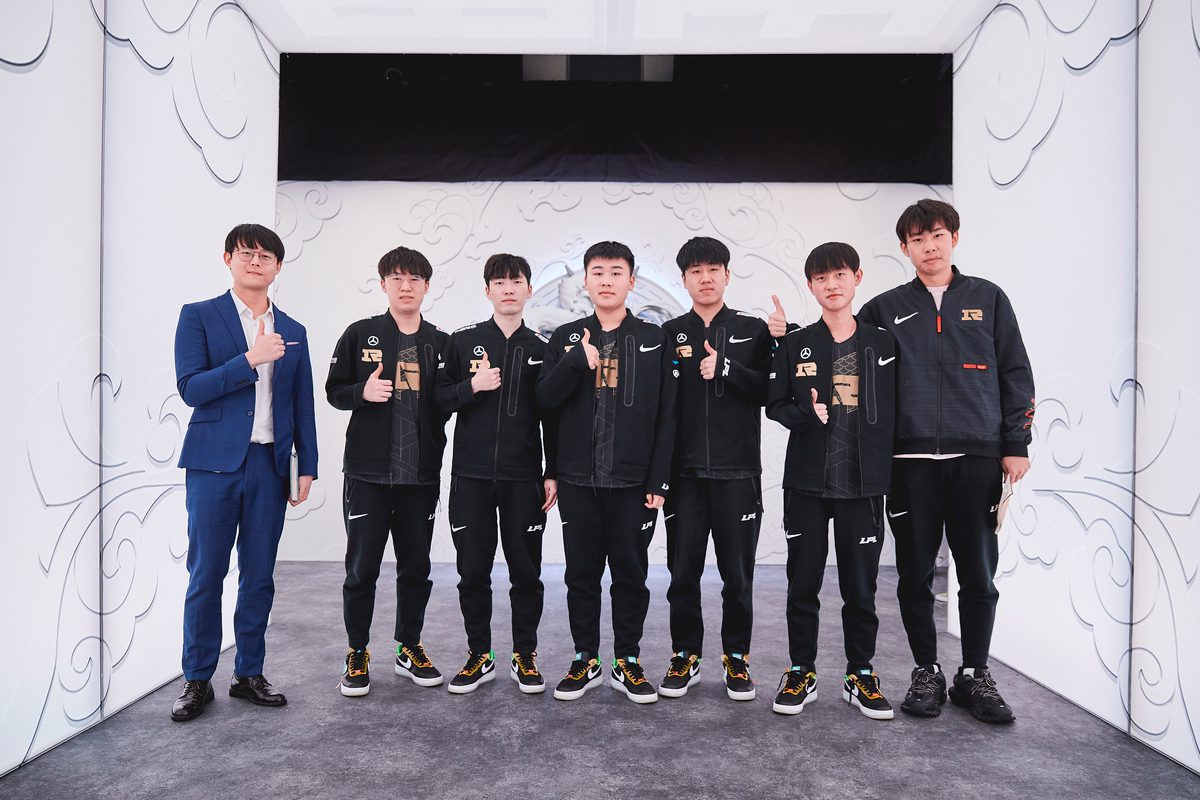 Royal Never Give Up poses after a victory match at the 2021 League of Legends World Championship Groups Stage