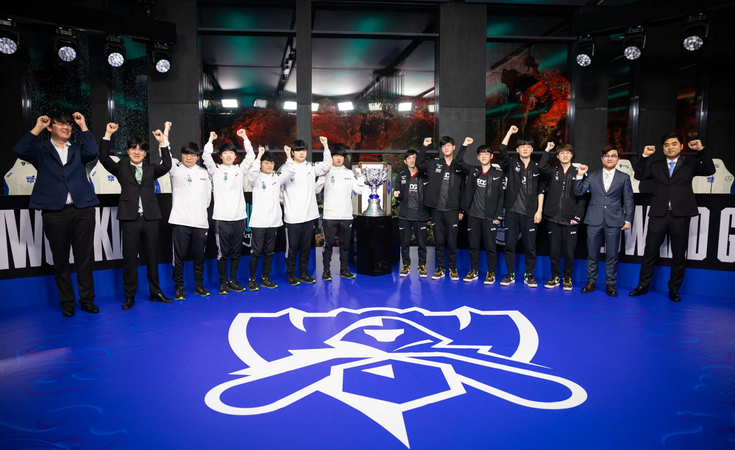 Team DAMWON KIA (L) and team EDward Gaming pose at the League of Legends World Championship Finals Media Day