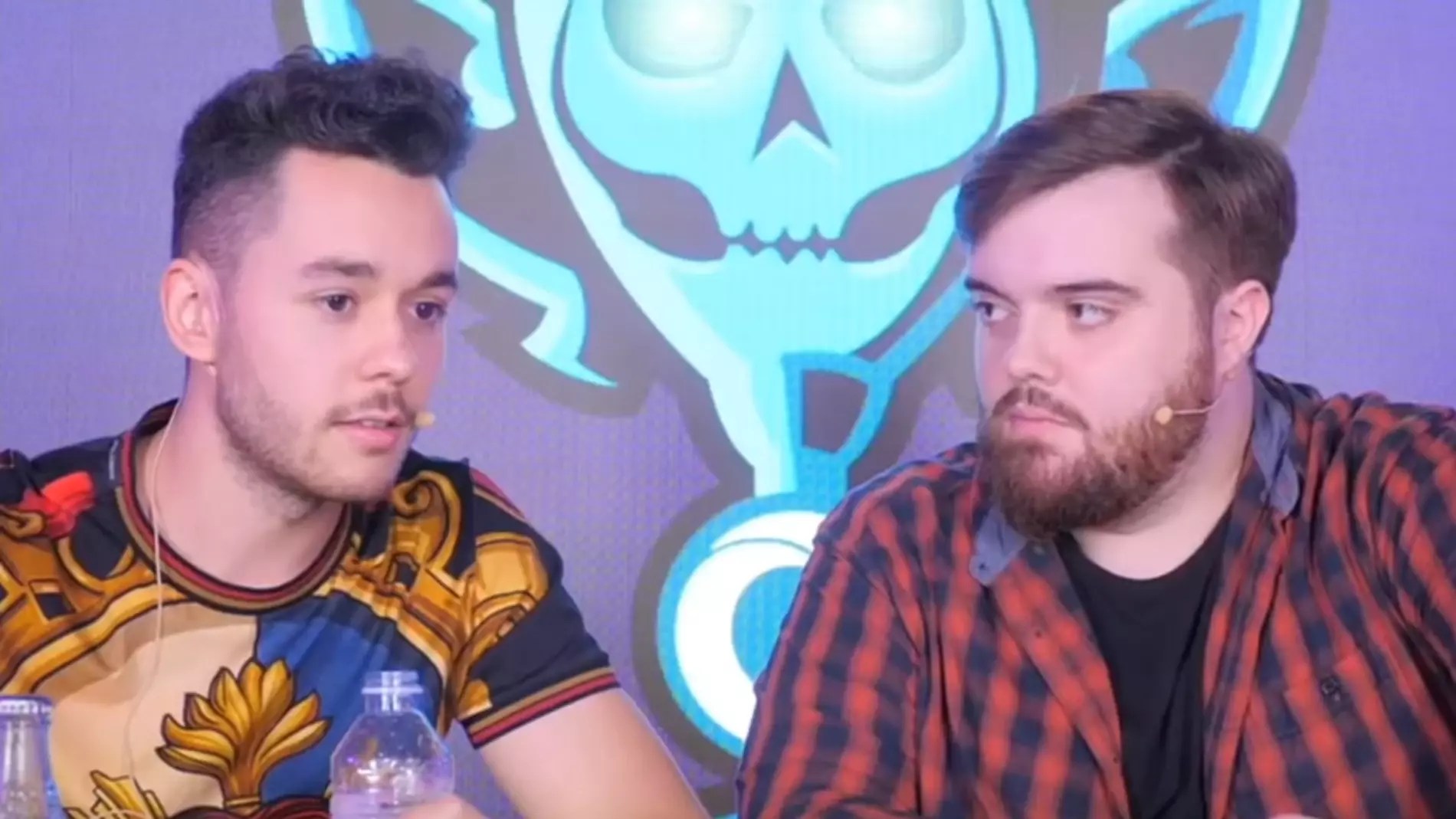 KOI and Heretics owners photographed at an event