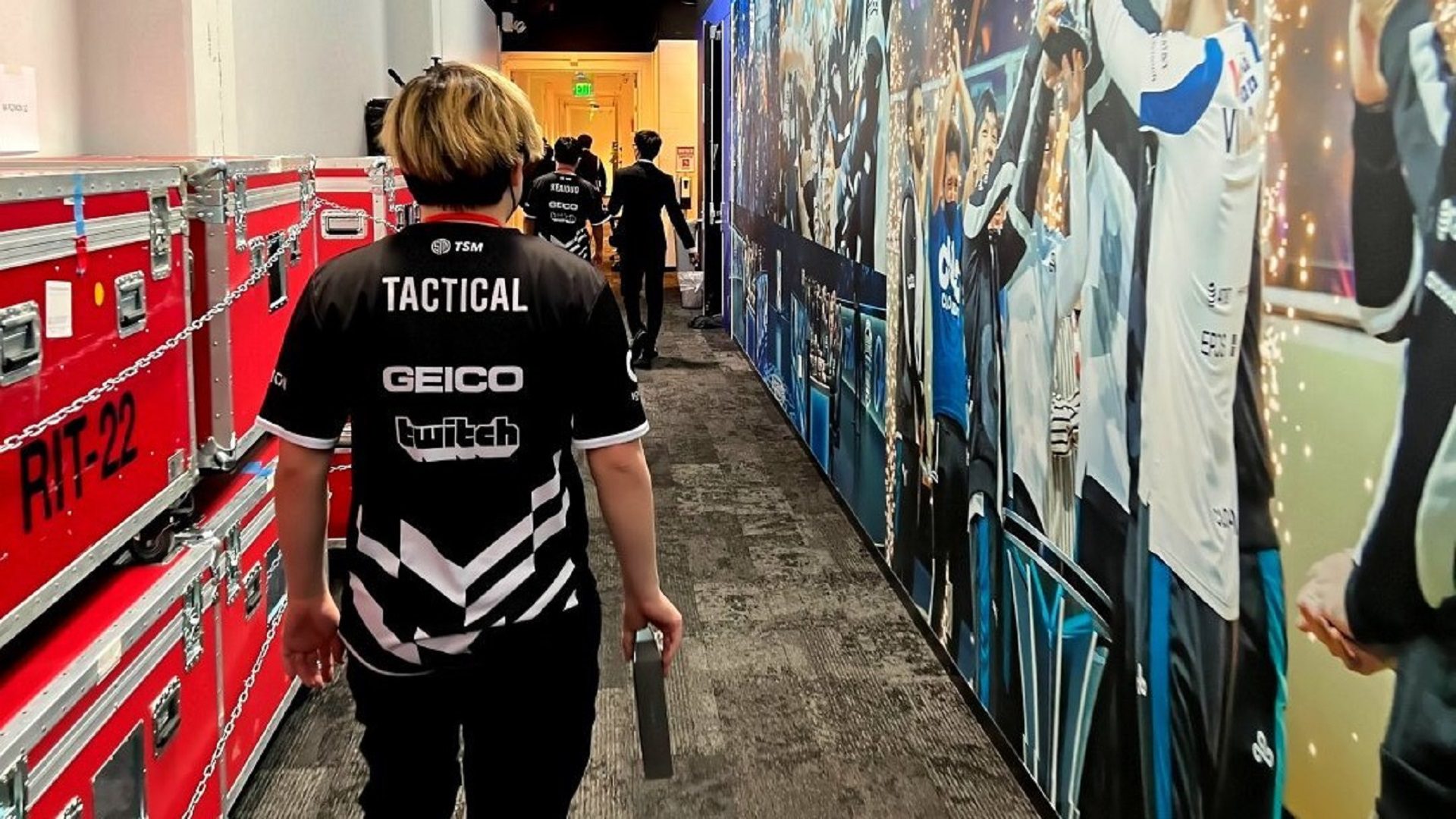 TSM Tactical walking through a mural hallway