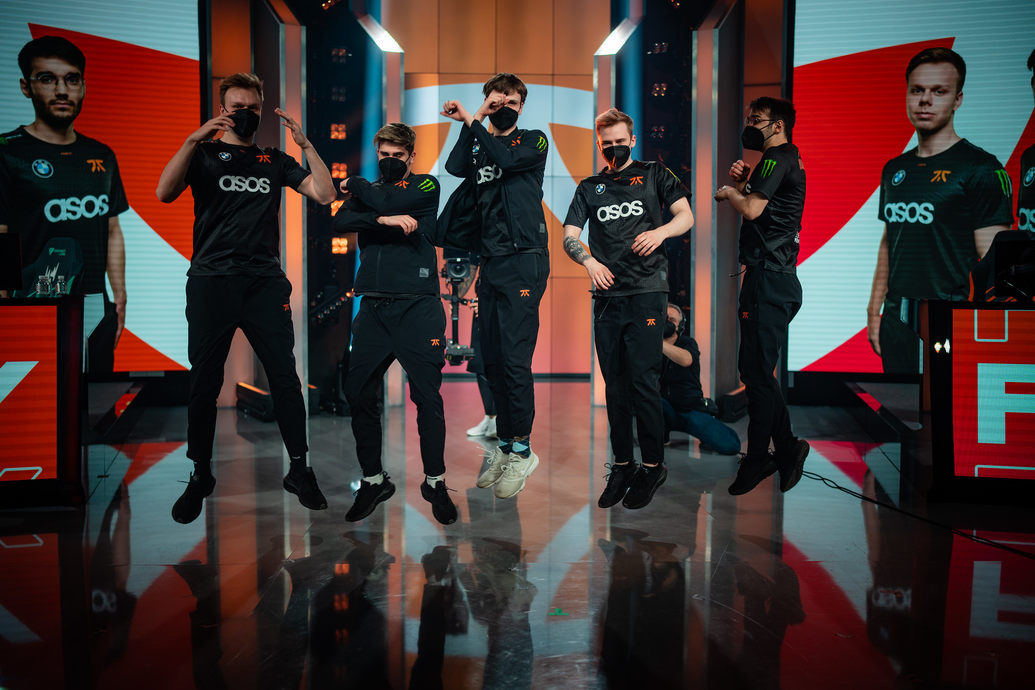 Fnatic players mid-air during their celebration after beating G2 Esports