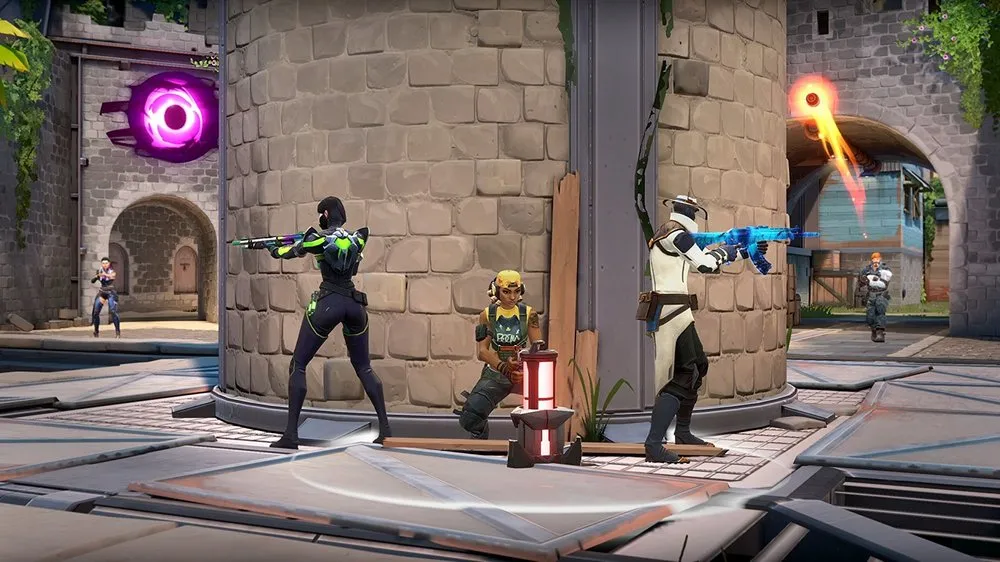 VALORANT characters sitting around a Spike with abilities going off around them.