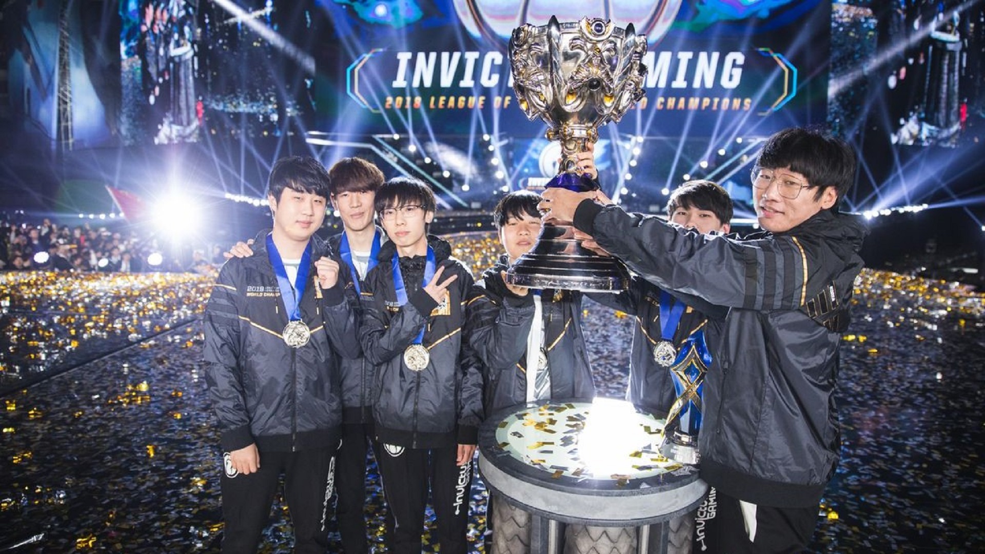 Invictus Gaming hold their trophy after winning the 2018 LoL World Championship