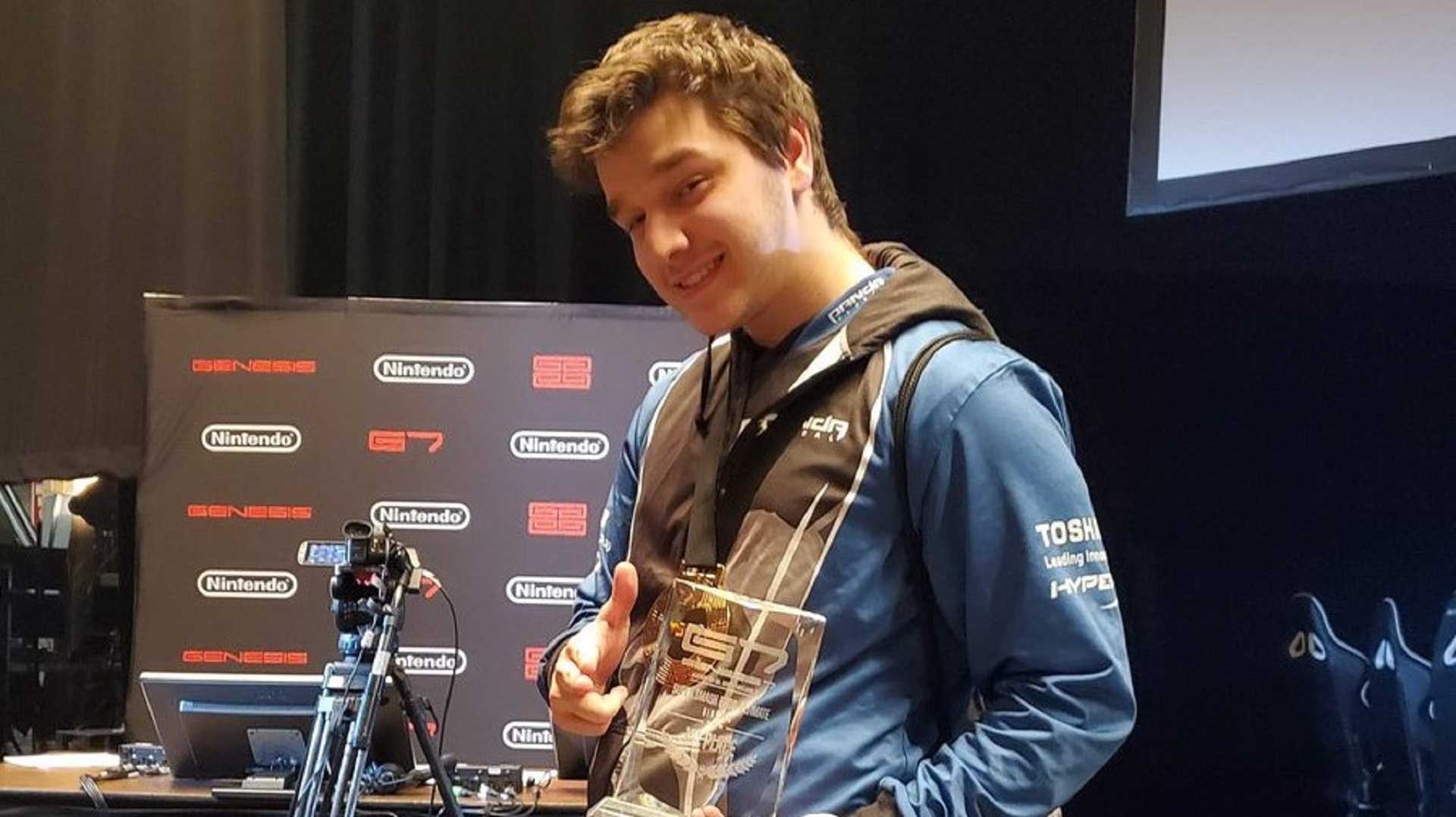 Panda Marss poses with his Genesis 7 trophy.