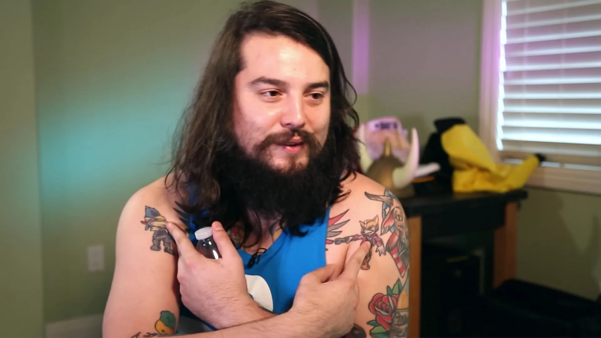Melee pro Mang0 shows off his Fox and Falco tattoos.