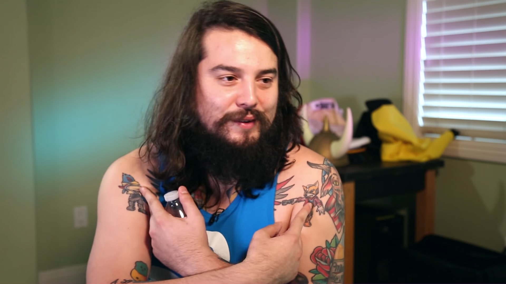 Melee pro Mang0 shows off his Fox and Falco tattoos.
