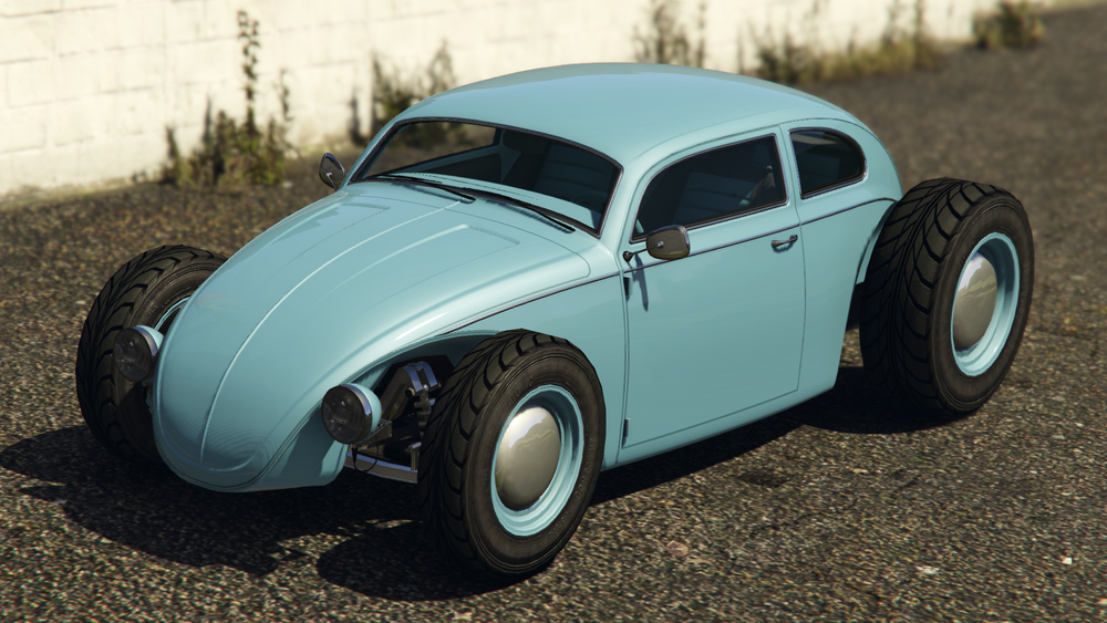 A blue BF Weevil Custom sitting beside a white wall with grass growing up it.