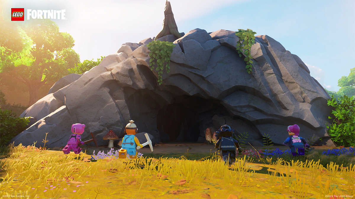 Four LEGO Fortnite characters running towards a cave.