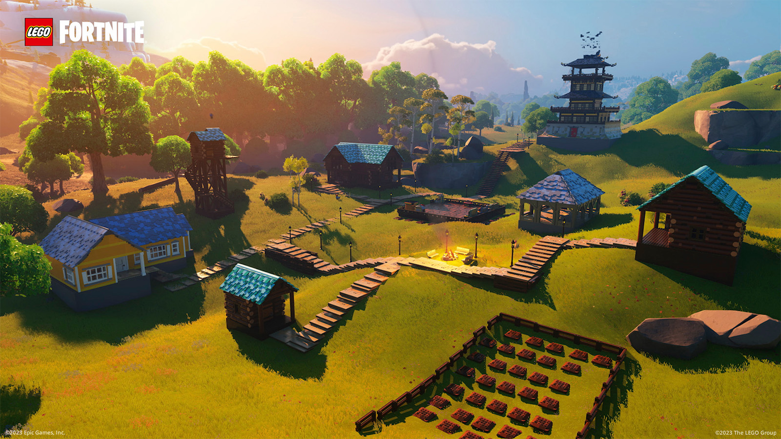 A village in LEGO Fortnite, built in grasslands, with a farm, a bungalow, a village square, and two towers.