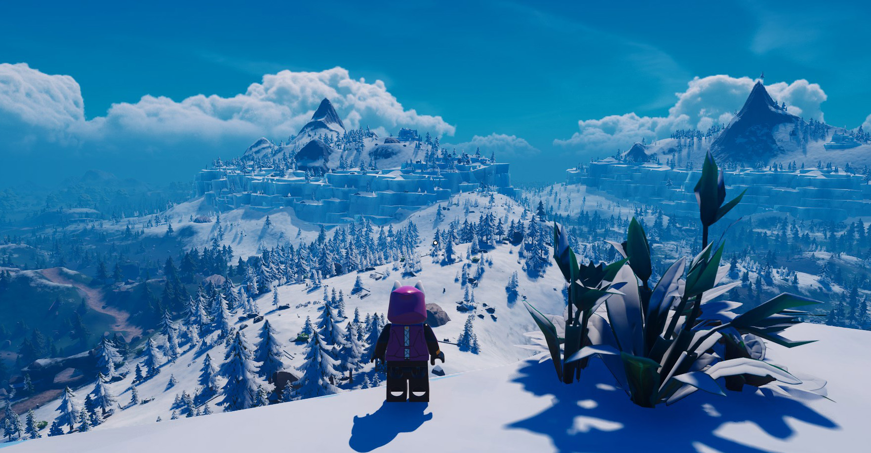 A LEGO Fortnite character standing on a mountain overlooking the snow Frostlands biome. 