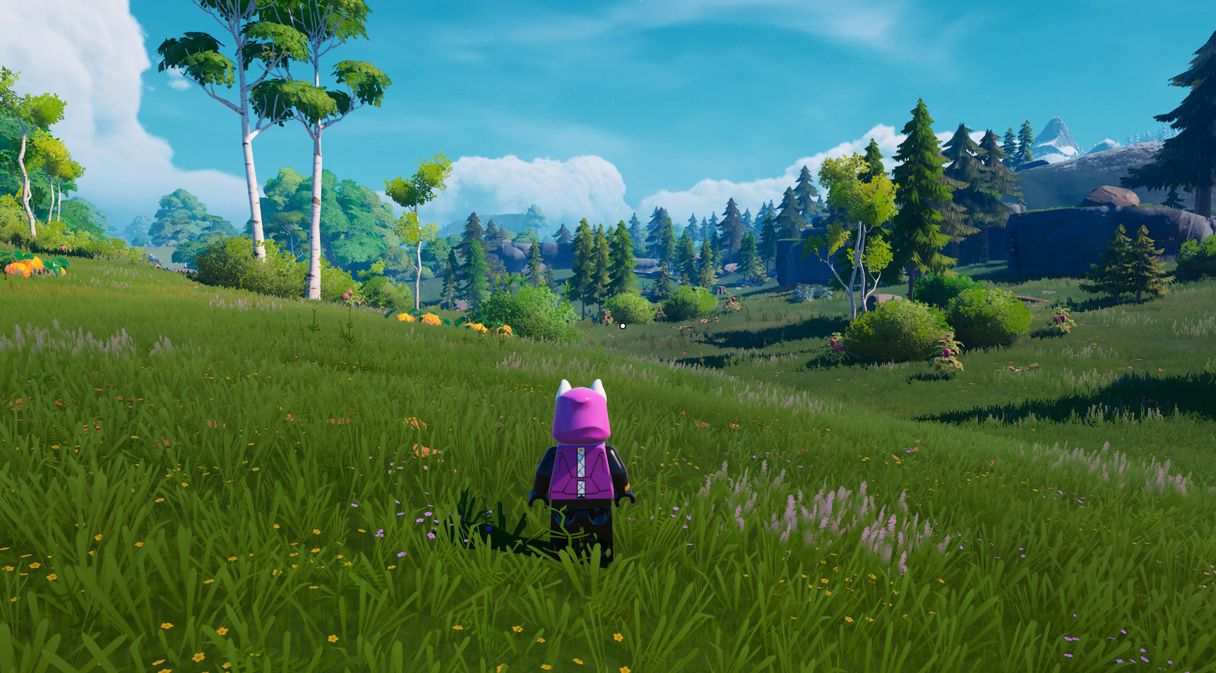A LEGO Fortnite standing in the grasslands, with trees, bushes, and pumpkins. 