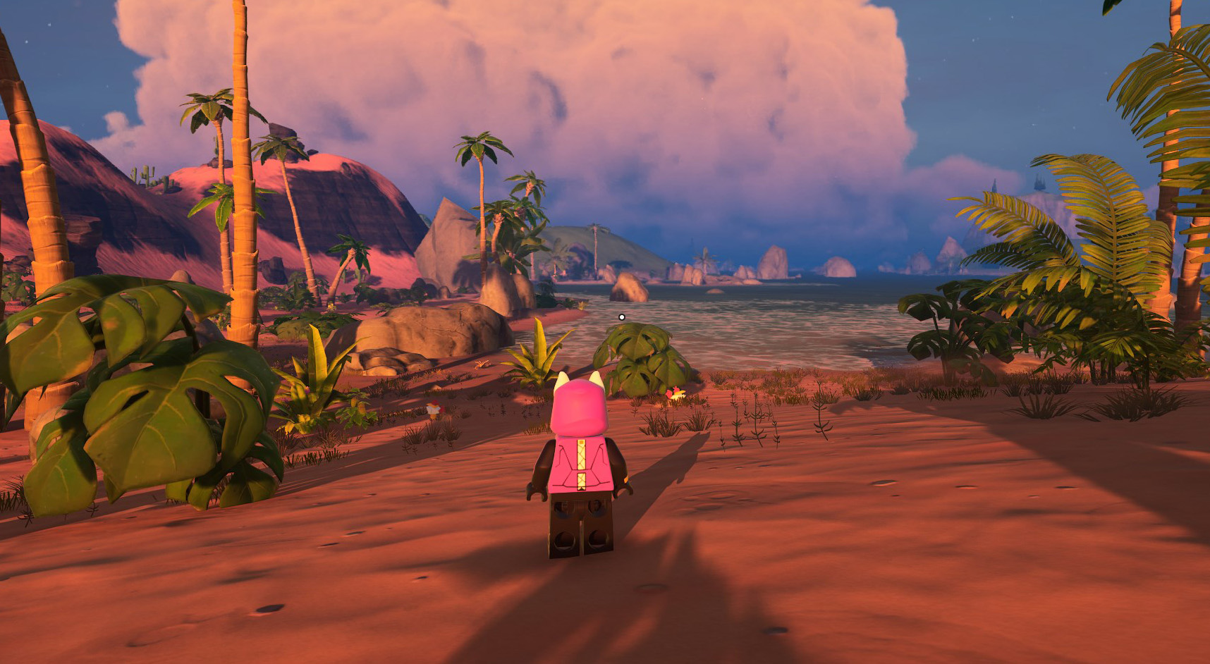 A LEGO Fortnite player standing in a Shore biome, with bushes and palm trees. 