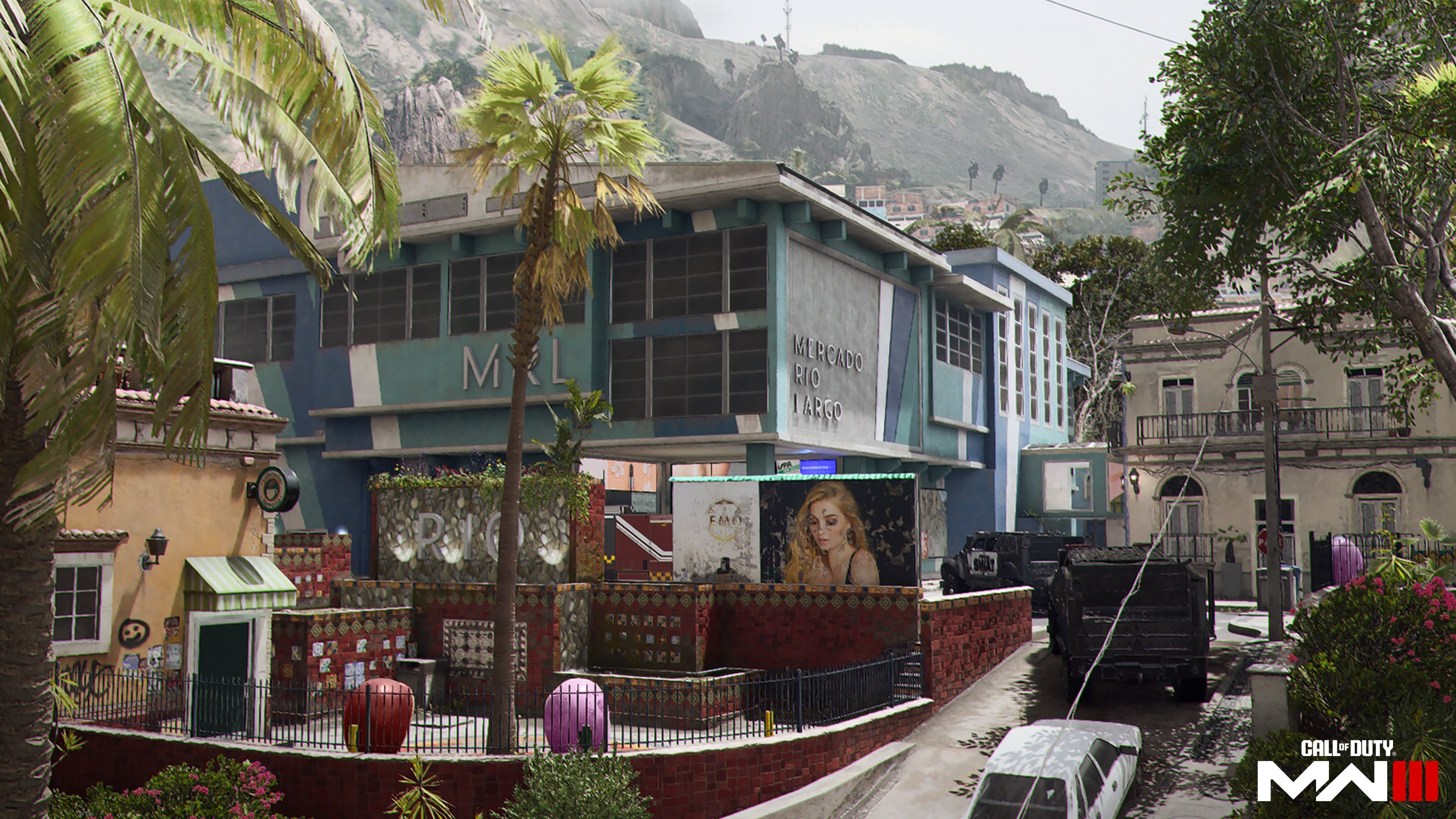A blue shopping mall in Rio de Janeiro, with a red wall outside, and two armored trucks.