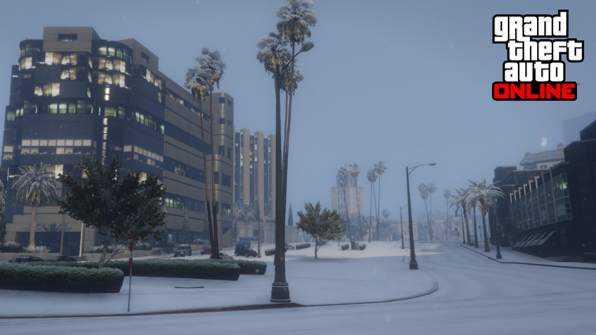 A snow covered street in GTA Online, with palm trees, cars, and buildings.