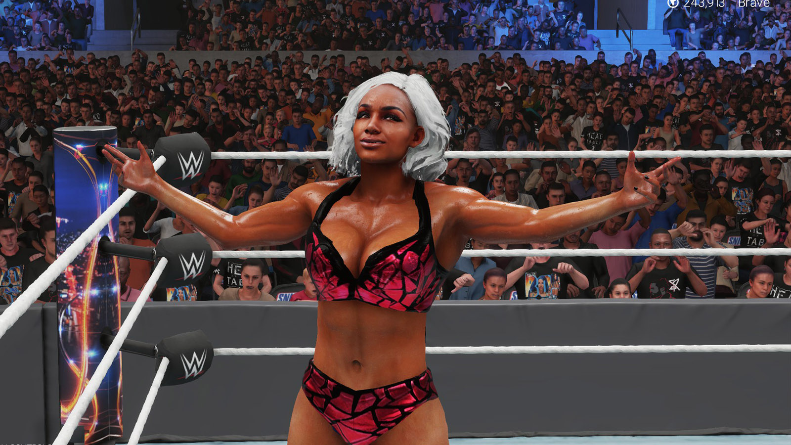 A CAW of Jade Cargill, wearing pink gear, standing in a WWE ring in WWE 2K23.