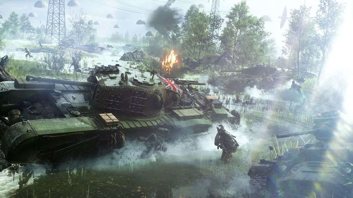 A tank is stuck in the water with soldiers around it in Battlefield V.