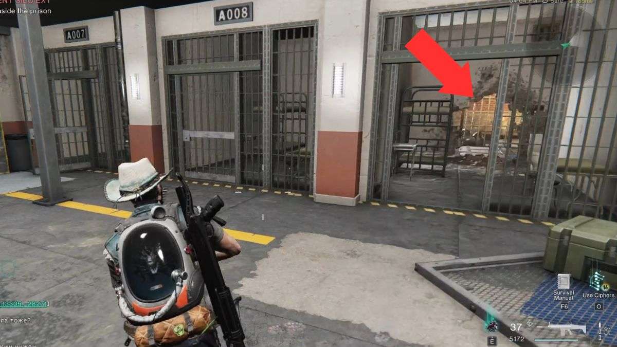 An arrow showing the way to a hole in a cell leading to secret crates in Securement Silo EX1.