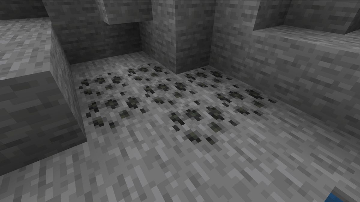 Coal Ore in a mountain side in Minecraft, showing players how to find Coal in Minecraft.