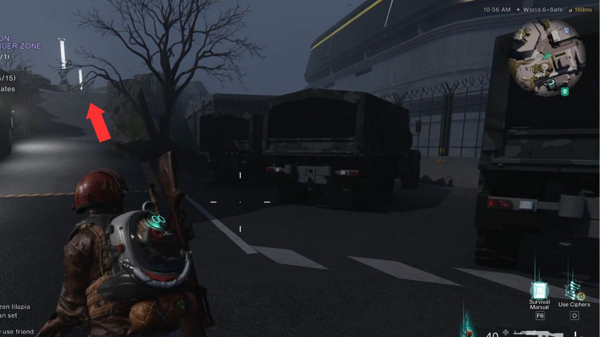 The player running past army trucks on the way to the mystical crate in Once Human.