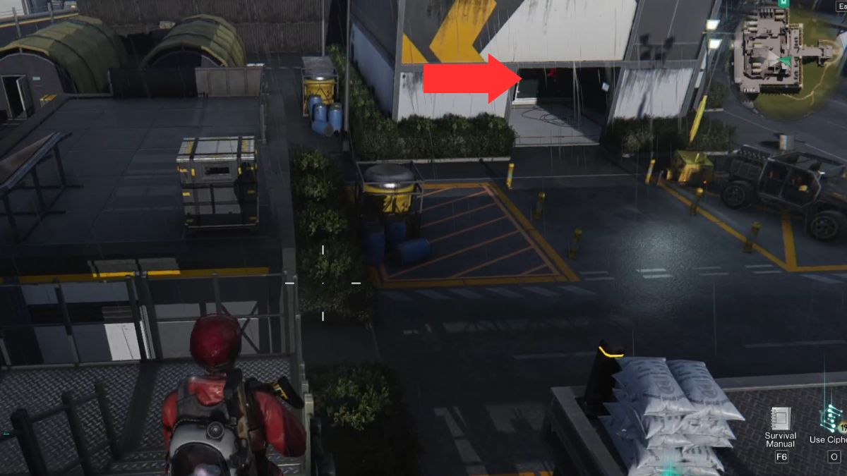 The building that houses the Mystical Crate at Gaia Military Base highlighted by an arrow. 