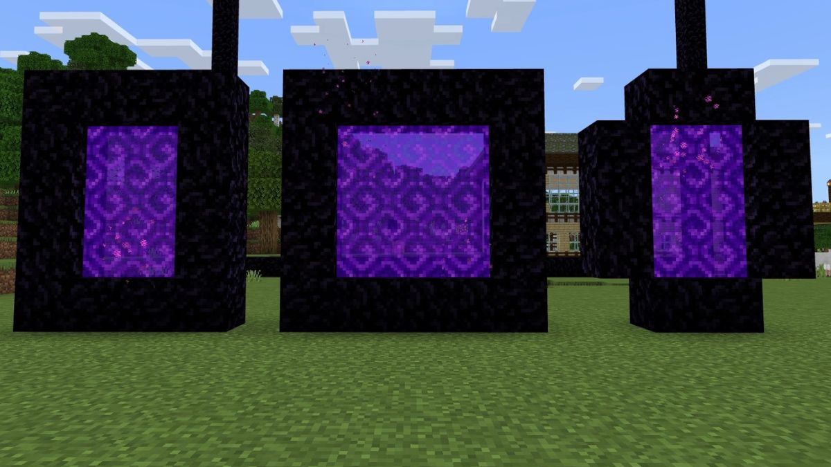 Different types of portals a player can build in Minecraft, laid out on a grassy field. 