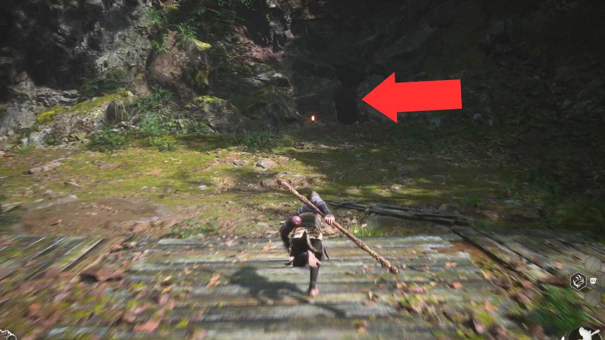 A crack in the rocks where the player can progress, highlighted by an arrow in the Forest of Wolves in Black Myth: Wukong. 