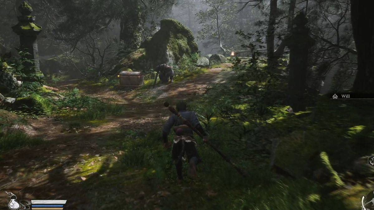 A player approaches an enemy guarding a chest in the Forest of Wolves in Black Myth: Wukong.