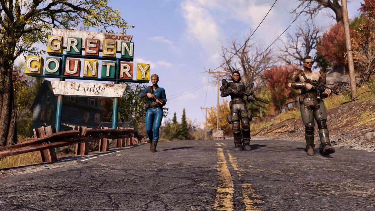 Three Fallout 76 characters walk down a road past a Green Country sign. 