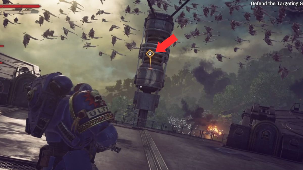 An arrow highlights the command icon appearing on screen after giving marines a command in order to defend the antennae in Space Marine 2.