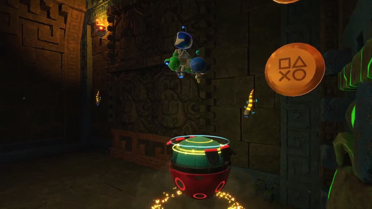 Astro Bot jumps towards a platform with glowing torches and PlayStation-themed icons in an Aztec-styled room with stone carvings.