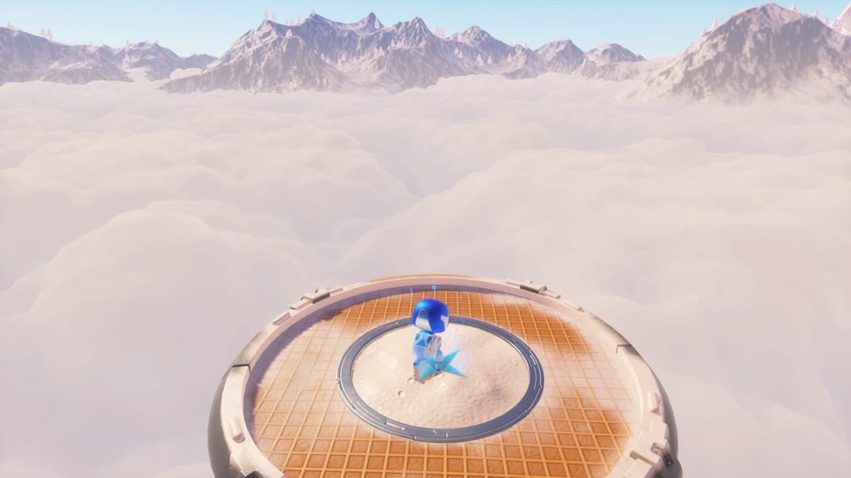 Astro Bot standing triumphantly on an elevated platform, overlooking a sea of clouds and mountainous terrain.