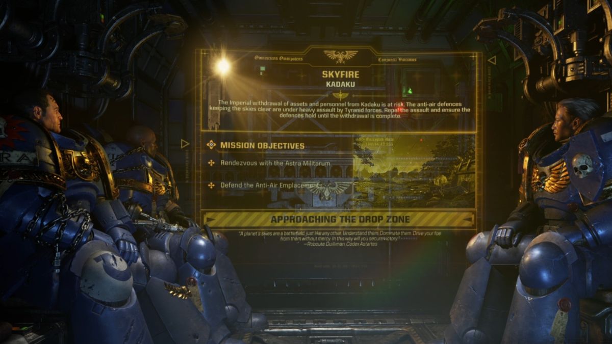 Marines sit on the briefing screen with the objectives visible before the start of the Skyfall mission and the defend the antennae objective. 