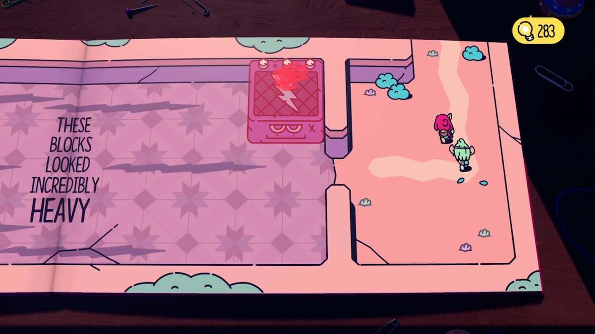 Deux personnages de The Plucky Squire passent devant le dernier bloc lourd avec un symbole d'éclair après avoir résolu le puzzle. 