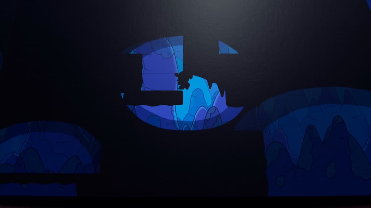 Los personajes de Plucky Squire navegan por una sección sombría de la cueva, escalando repisas con púas en las secuencias de resolución de acertijos del juego.