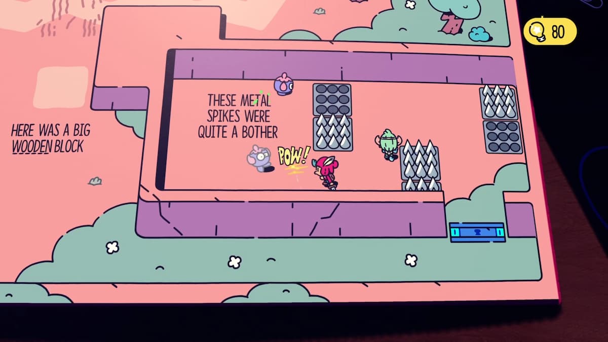 Los personajes de Plucky Squire navegan por una sección desafiante llena de púas de metal, con un texto que indica que las púas son bastante molestas.