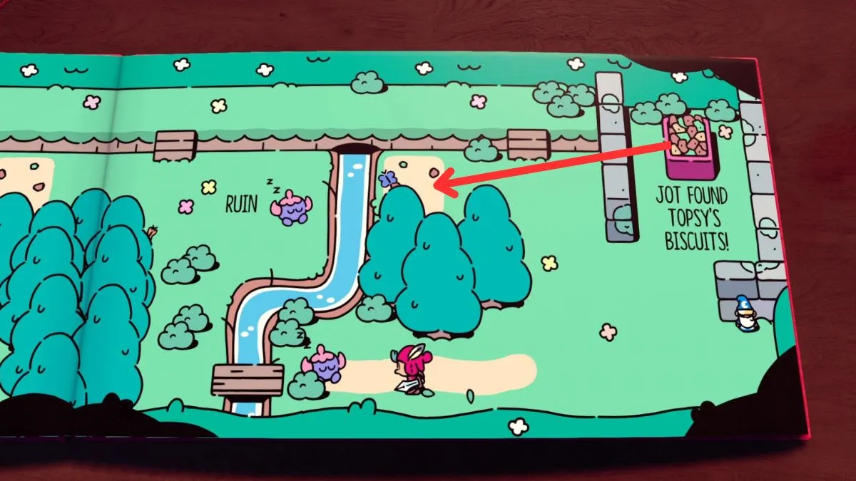 Topsy's biscuit tray in The Plucky Squire with an arrow showing where to move it next.