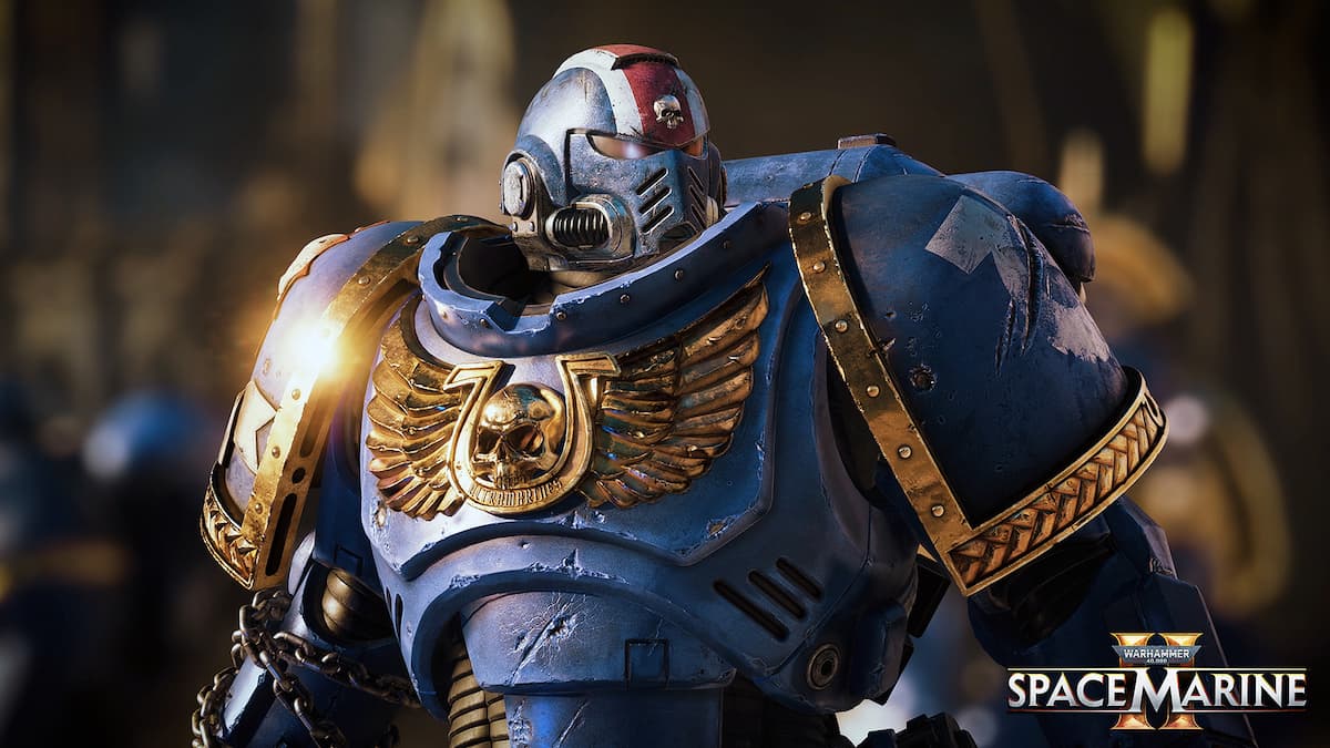 A Space Marine in blue and gold armor, adorned with the iconic Ultramarines insignia, stands stoically amidst the battlefield in Warhammer 40,000: Space Marine 2.